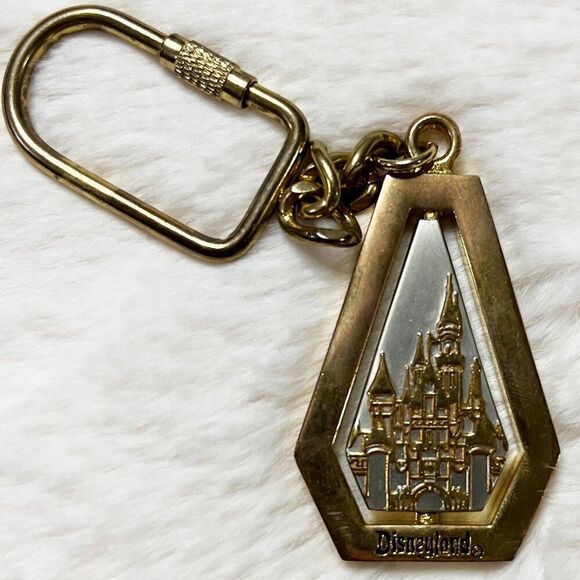 🔮 5/$25 Disney Gold Silver Metal Disneyland Tinker‎ Bell Castle Spin Keychain - Picture 1 of 6